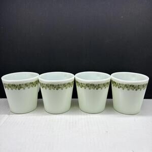 Set of four Pyrex milk glass coffee cups with Crazy Daisy pattern.